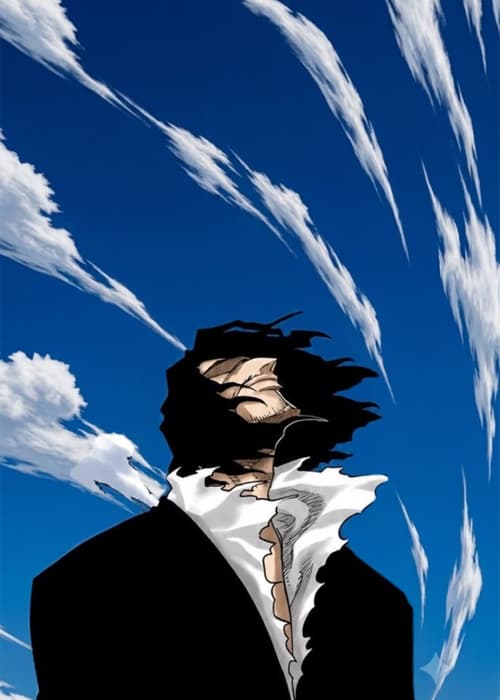 Man in a black coat with windswept hair under a deep blue sky streaked with clouds