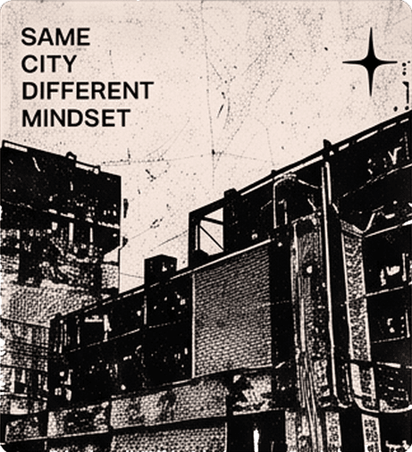 Grainy black-and-white city buildings on cream with "Same city different mindset" and a star